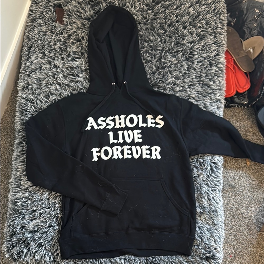 Black Unisex Assholes Live Forever Graphic Hoodie